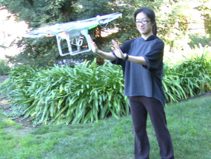 person gesturing to a drone